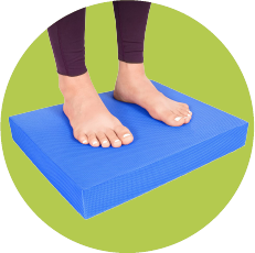 Blue exercise balance pad with feet on top